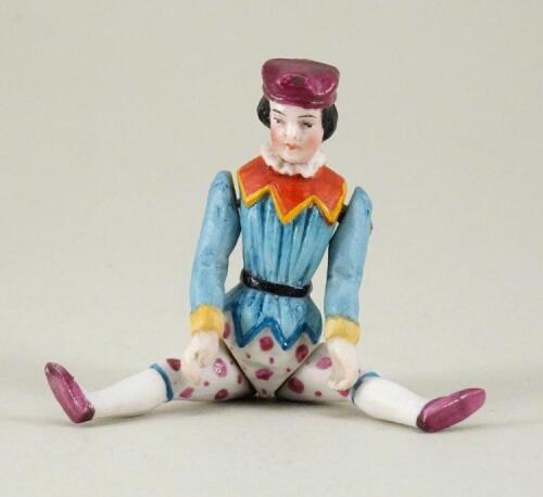 A small all-bisque Boy in moulded costume, German 1870s,