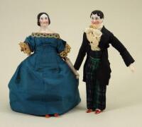 A miniature pair of rare early glazed china shoulder-head dolls on wooden jointed bodies, German mid 19th century,