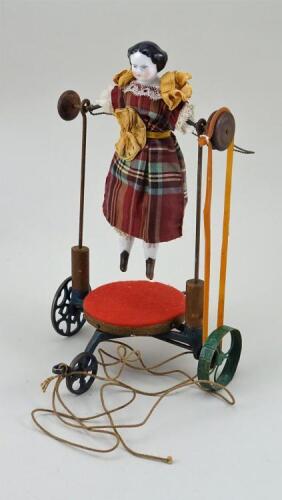 Rare American pull-along skipping doll on wheels, 1860s,