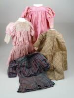 Four dolls dresses,