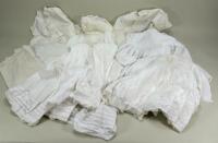 A good selection of white cotton dolls dresses and underclothes,