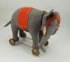 A good grey felt Schuco Roller Yes/No Elephant on wheels, German 1920s,