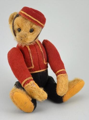 A rare early Schuco Yes/No Bell Hop Teddy bear, circa 1920,