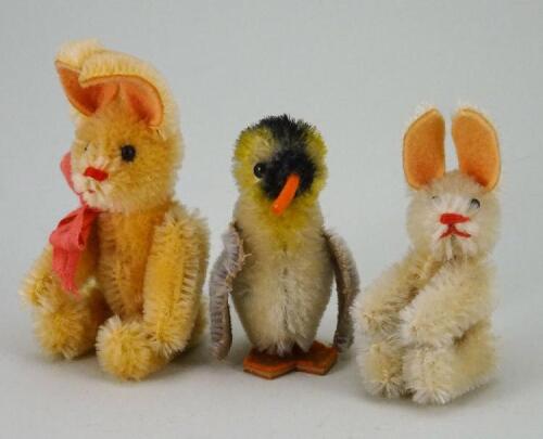 Schuco miniature mohair Penguin and two Rabbits, 1950s,