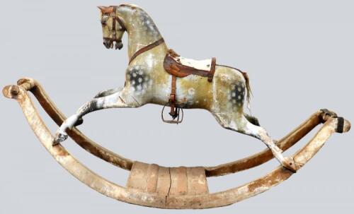 A good and large carved and painted wooden rocking horse on bow rockers, possibly F.H Ayres,