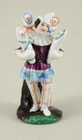 A continental porcelain figurine ‘The Doll Seller’, 19th century,