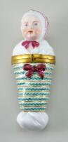 A Dresden porcelain Baby in Swaddling Scent Bottle holder, late 19th century,