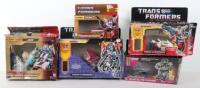 Five boxed Hasbro Transformers