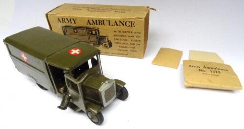 Britains early post-war set 1512, Army Motor Ambulance FIRST VERSION, khaki finish, black treaded tyres with driver in original illustrated card box (Condition Very Good, box Fair, flaps loose) 1947 (2)