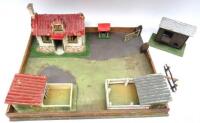 A Hugar Walled Farmyard with Britains gate, various other makers buildings, Britains and other accessories, fences, gates and trees (Condition Good-Poor, some damage) (76)