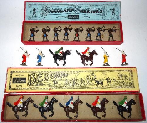 Britains set 164, Mounted Arabs in original Whisstock box with two additional mounted and four marching (Condition Good, box Poor) and set 202, Togoland Warriors with bows in original Whisstock box (Condition Good, box Fair, insert missing) 1946 (19)