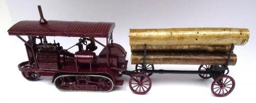 Toy Army Workshop Holt Caterpillar Tractor 1916 burgundy finish, with driver and log trailer with five logs (Condition Excellent, one log support broken) (8)