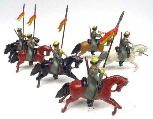 Britains RARE PARIS OFFICE Russian Cossacks with Officer on grey horse and Trumpeter, 'depose' under bellies, paint in the Paris style, but riders painted in a semi-matt grey green indicating repainting (Condition Very Good) (6)
