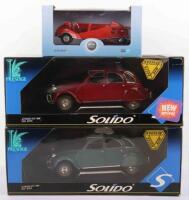 Three 1/18 scale boxed diecast model cars