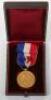 A French gold marine life saving medal, engraved “Ministere De La Marine Courage Et Devouement”