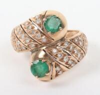 A gold, diamond and green stone ring