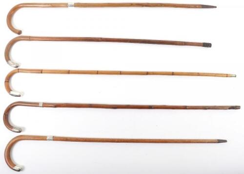Five silver banded malacca walking sticks, late 19th and early 20th century
