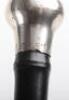 Four ebonised walking canes, - 12