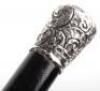 Four ebonised walking canes, - 17