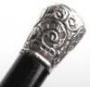 Four ebonised walking canes, - 18