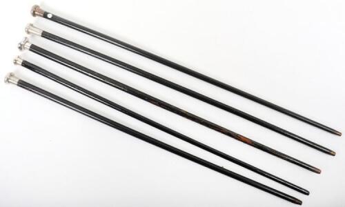 Five silver topped ebonised canes,