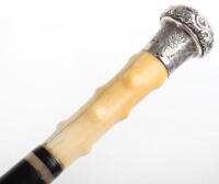 A fine 19th century ebony silver and ivory walking cane, London 1887