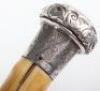 A fine 19th century ebony silver and ivory walking cane, London 1887 - 6
