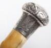 A fine 19th century ebony silver and ivory walking cane, London 1887 - 7