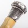 A fine 19th century ebony silver and ivory walking cane, London 1887 - 8