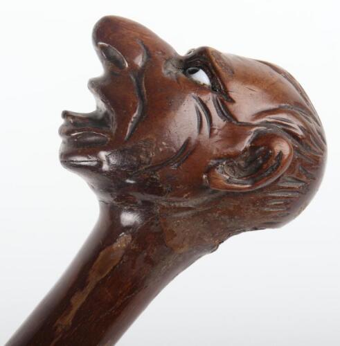 A carved wood &lsquo;grotesque&rsquo; walking stick