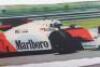 A Malboro mirrored sign with the McLaren Formula One car of Niki Lauda and Alain Prost - 3
