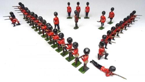 Britains set 120, Coldstream Guards kneeling firing kneeling firing with Officer (set not matching), set 34, Grenadier Guards standing firing with Officer (drummer missing) and various other Foot Guards (Condition Good-Fair, two repainted, three damaged) 