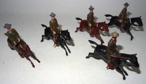 Britains from set 276, US Cavalry in action at the gallop, one trooper, with two later troopers (Condition Good) and two Picture Packs 39B (Condition Very Good) (5)