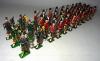 Britains from set 77, Gordon Highlanders marching at the slope with six Pipers (Condition Very Good, repainted, four recast, a few original, three feathers missing) (41)