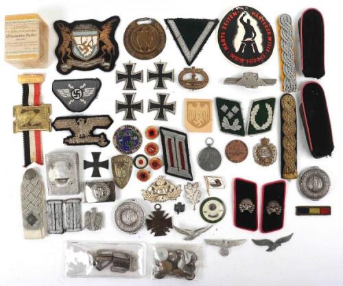 A mixture of German reproduction and original badges