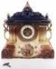 A 19th century painted ceramic cased mantle clock