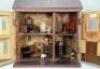 A traditional painted wooden dolls house, made by F.H.Crowe, Newmarket probably 1920s, - 2