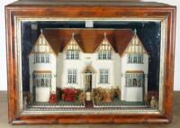 A charming model cottage in glass case, English 1906,