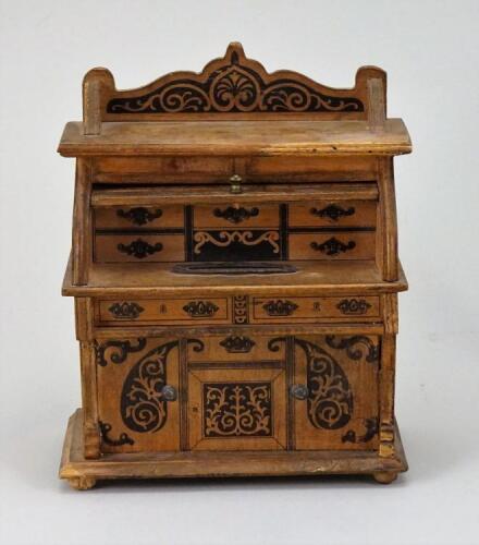 A miniature wooden desk money-box, German circa 1910,