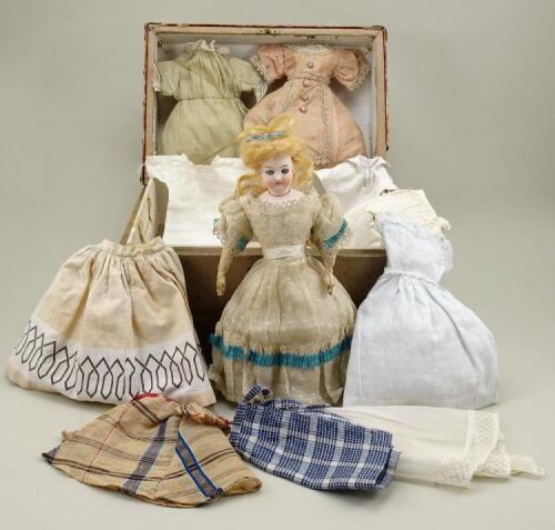 A fine bisque head B.S fashion doll with trunk and clothing, French circa 1870,