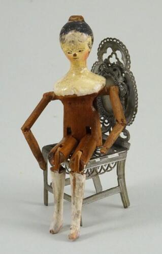 A small painted wooden Grodnertal doll, German circa 1830,