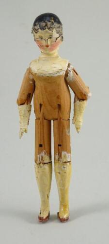 A small painted wooden Grodnertal doll, German circa 1830,