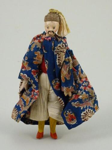 A rare miniature painted wood china man doll, German circa 1830,