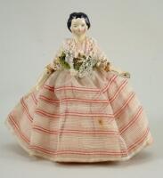 A small papier-mache shoulder head doll, German circa 1840,