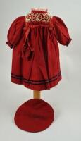 A red wool dolls dress and beret, German circa 1890,