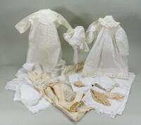 A selection of antique white cotton dolls clothes,