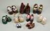 A collection of nine pairs of doll shoes,