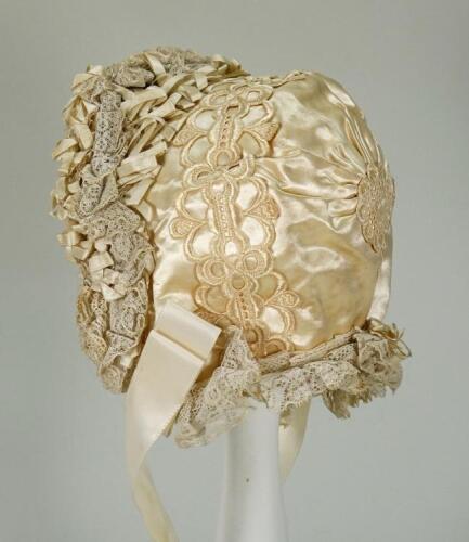 A beautiful ivory silk baby bonnet, late nineteenth century,