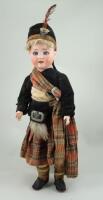 A Schonau & Hoffmeister 1909 bisque head doll in original Scottish clothes, German circa 1910,