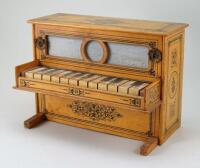 A Victorian child’s miniature wooden upright toy piano, German,